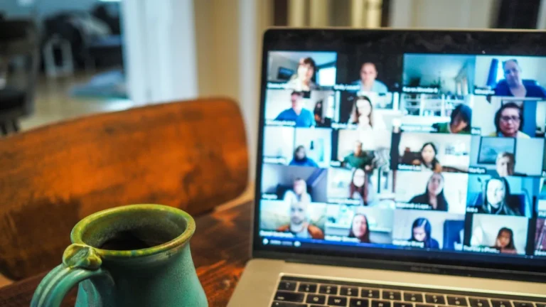 Remote team on a video call sharing project updates, showing everyday remote team productivity habits